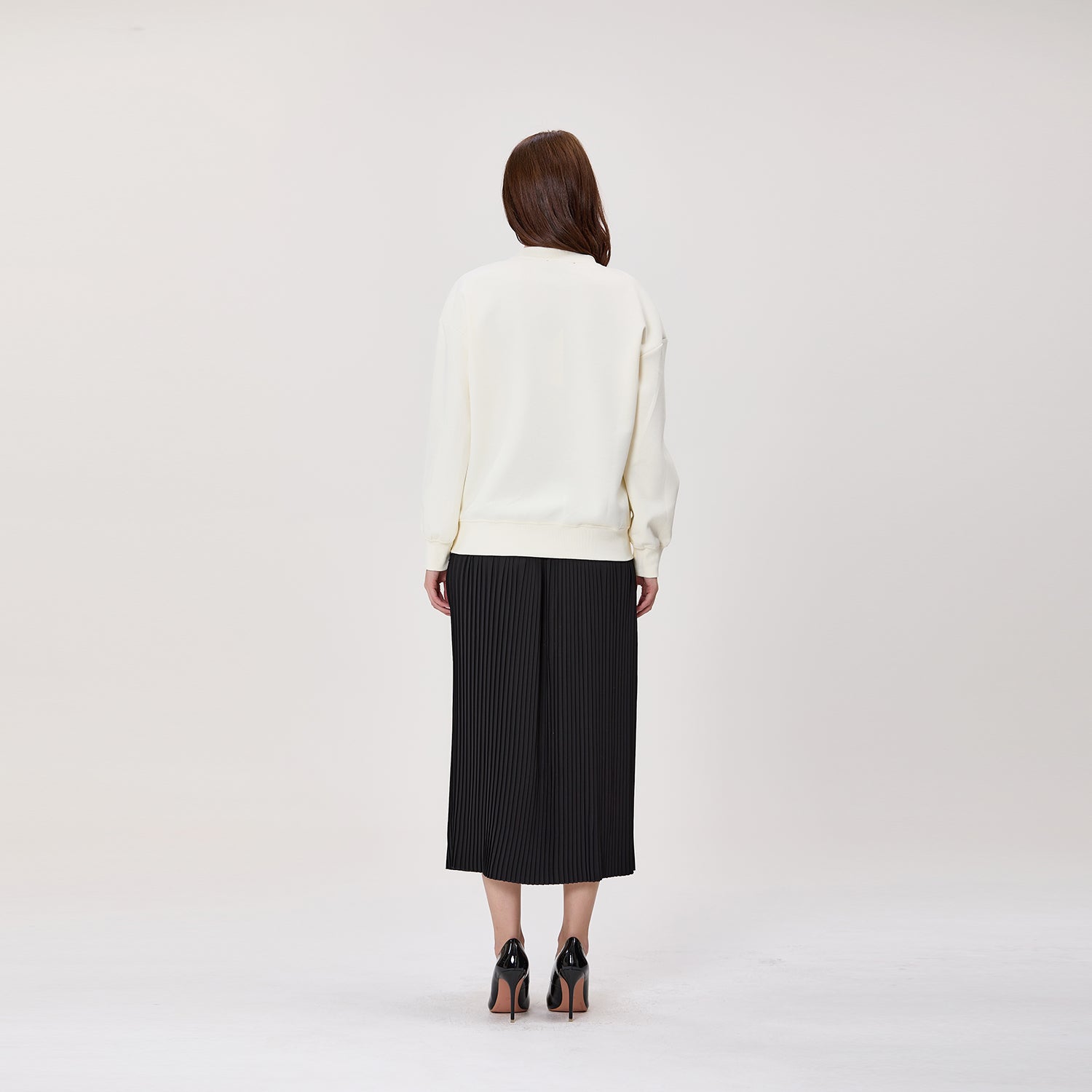 Jupe midi plissée avec taille effet cuir