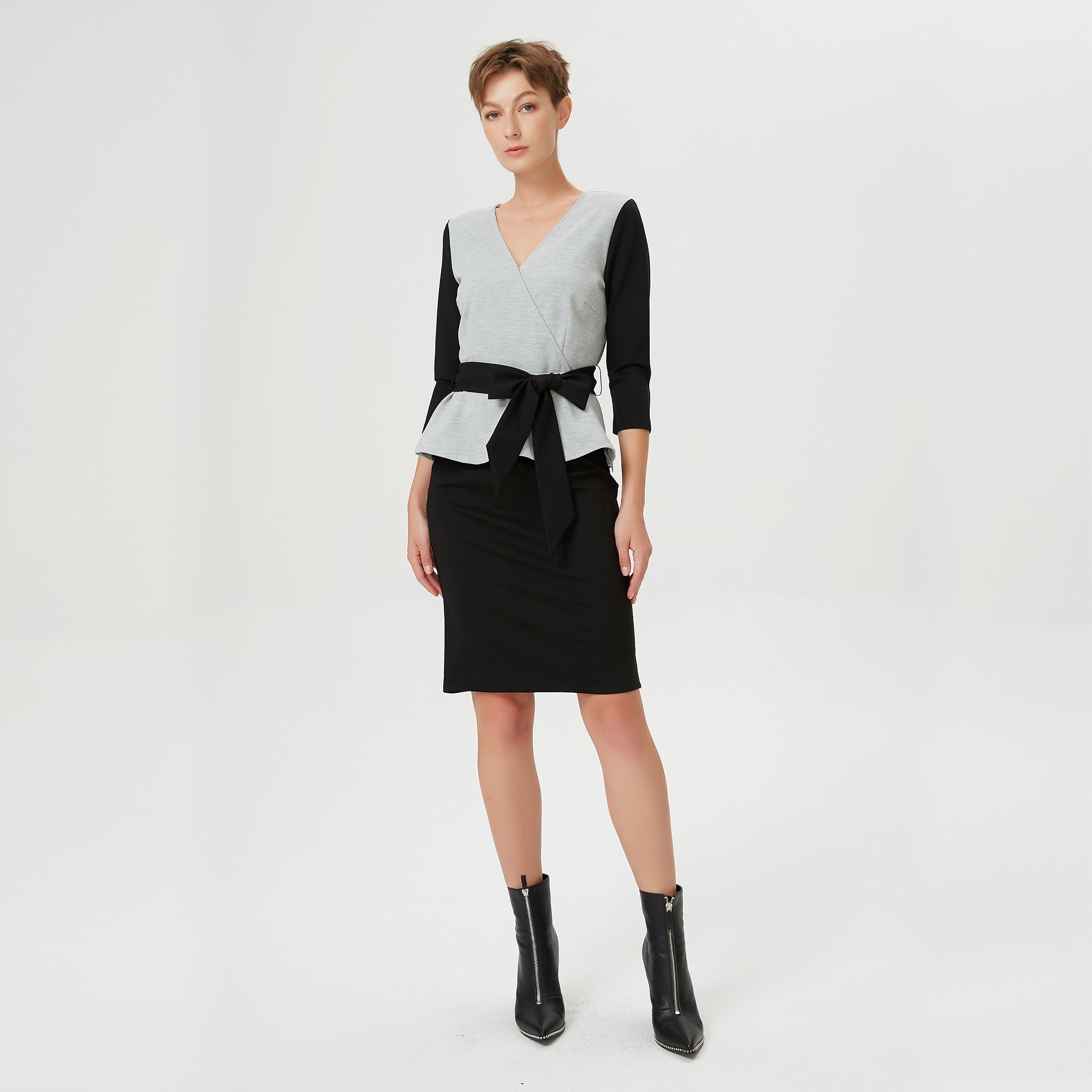 Top péplum bi-matière à effet cache-coeur et ceinture appliquée