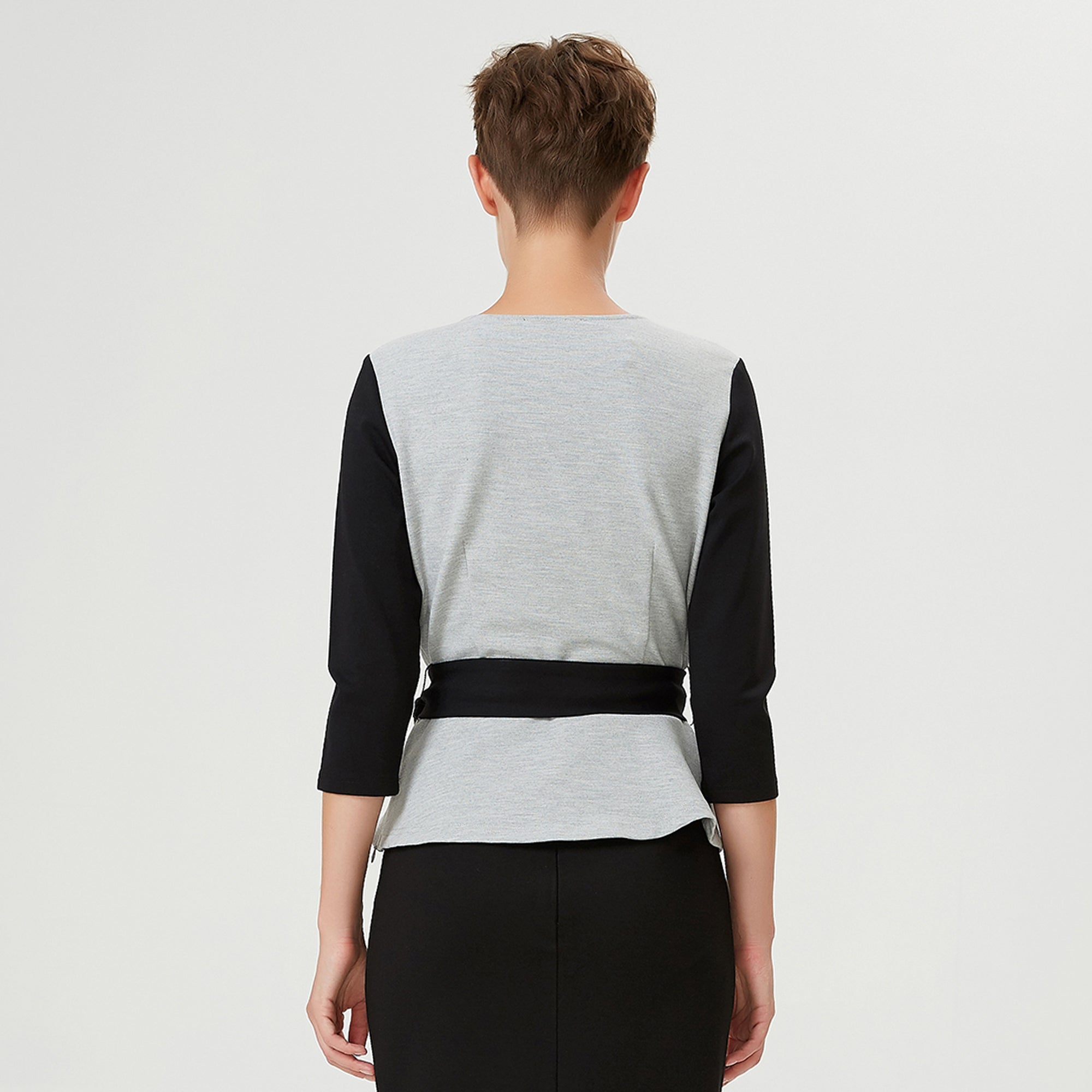Top péplum bi-matière à effet cache-coeur et ceinture appliquée