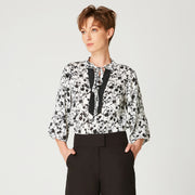Blouse à manches tulipes et imprimé floral monochrome et encolure contrastée