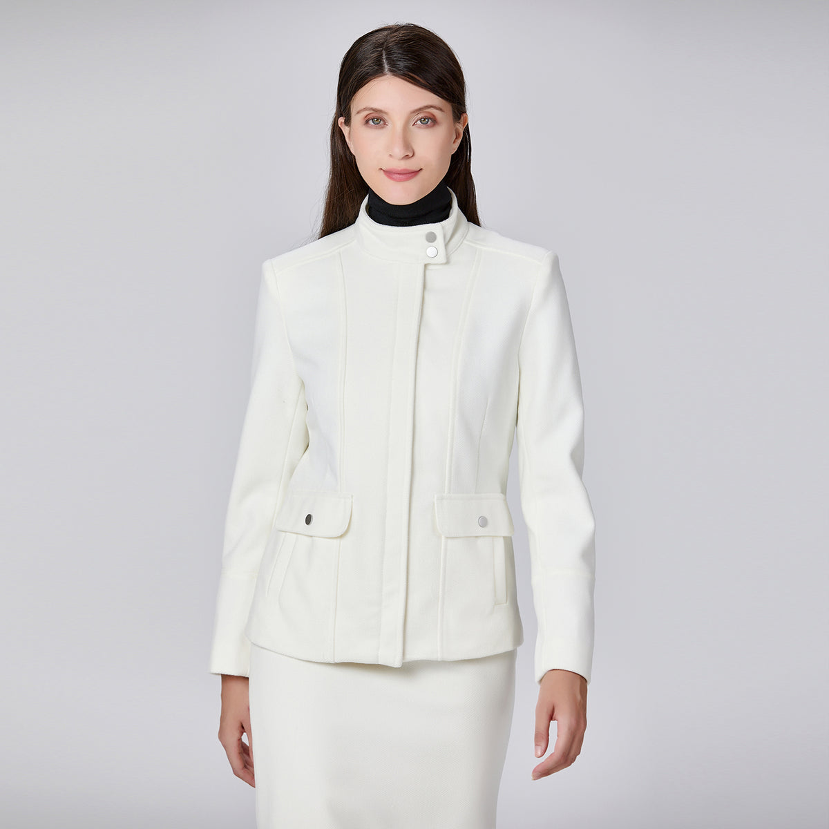 Veste minimaliste à col haut et poches plaquées