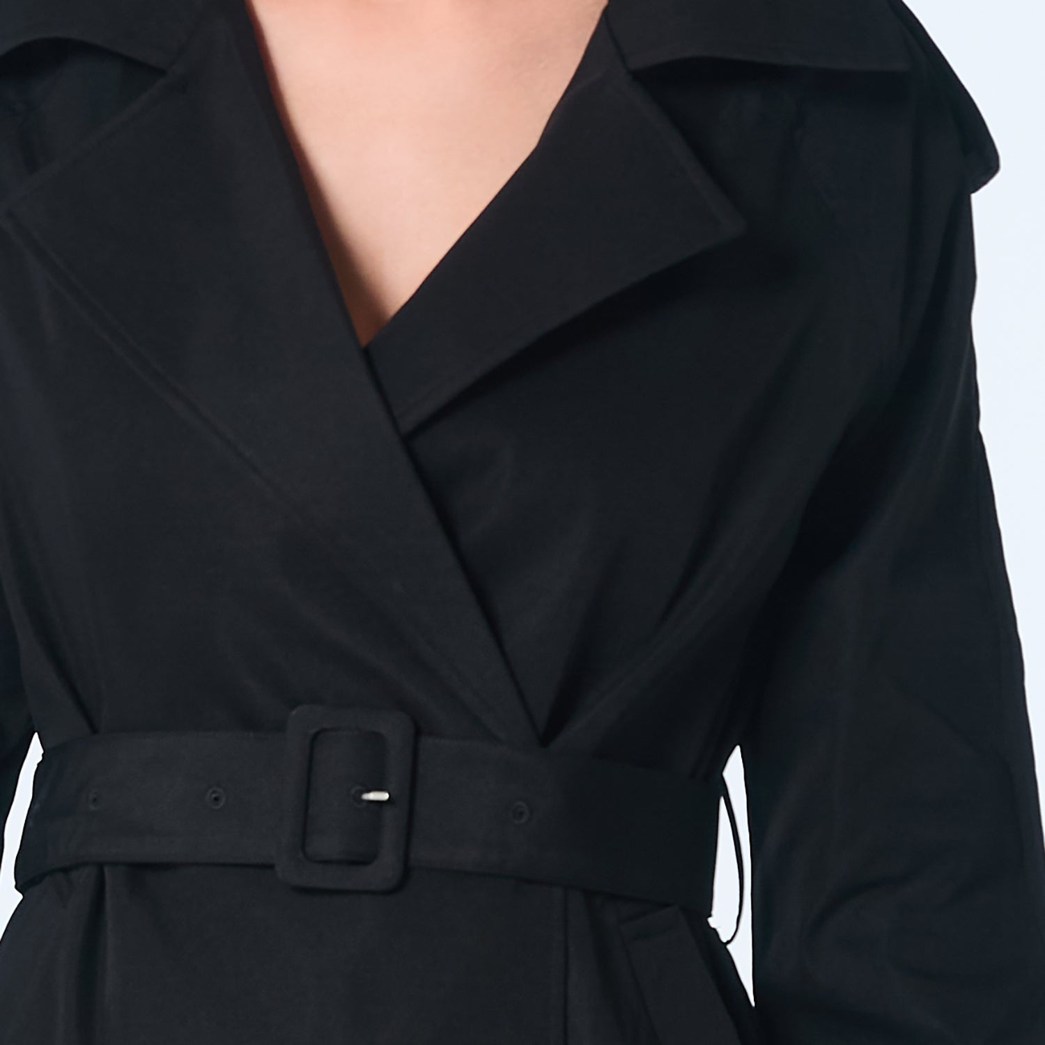Manteau trench classique avec un bas-volet