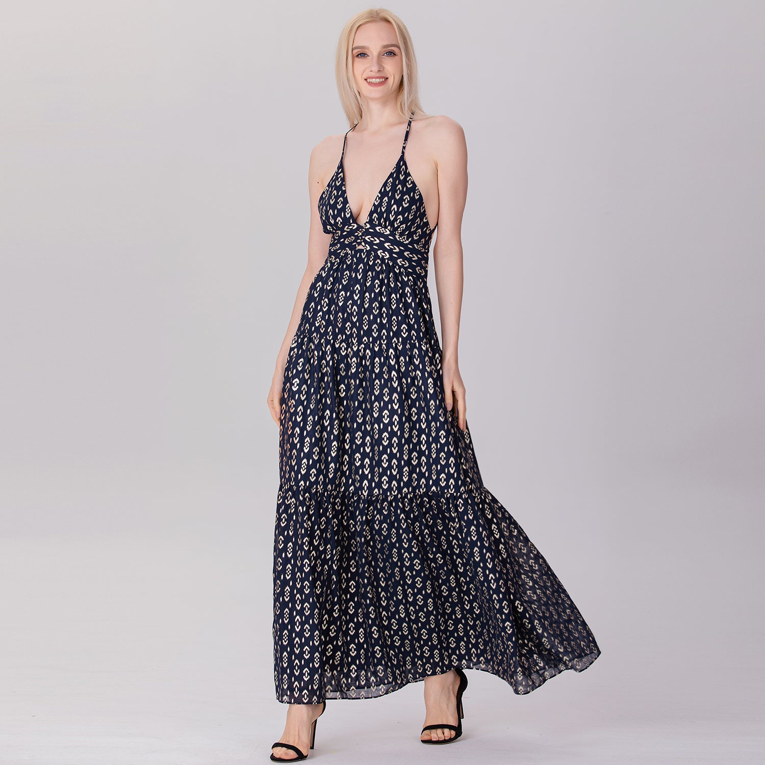 Robe longue dos nu à bretelles et empiècements évasés