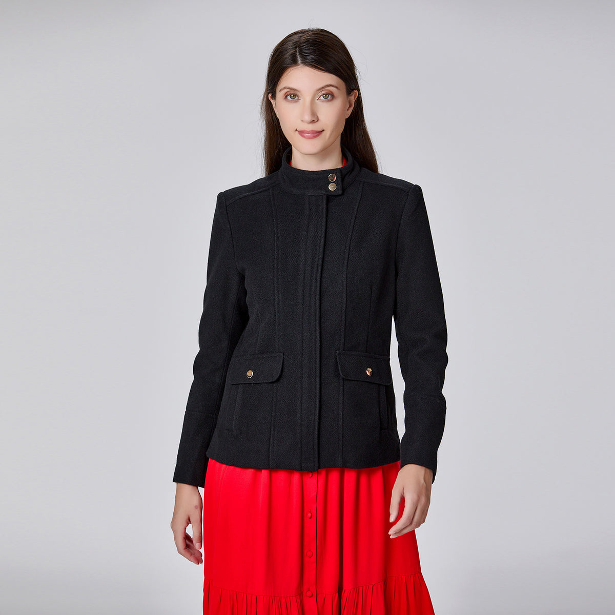 Veste minimaliste à col haut et poches plaquées